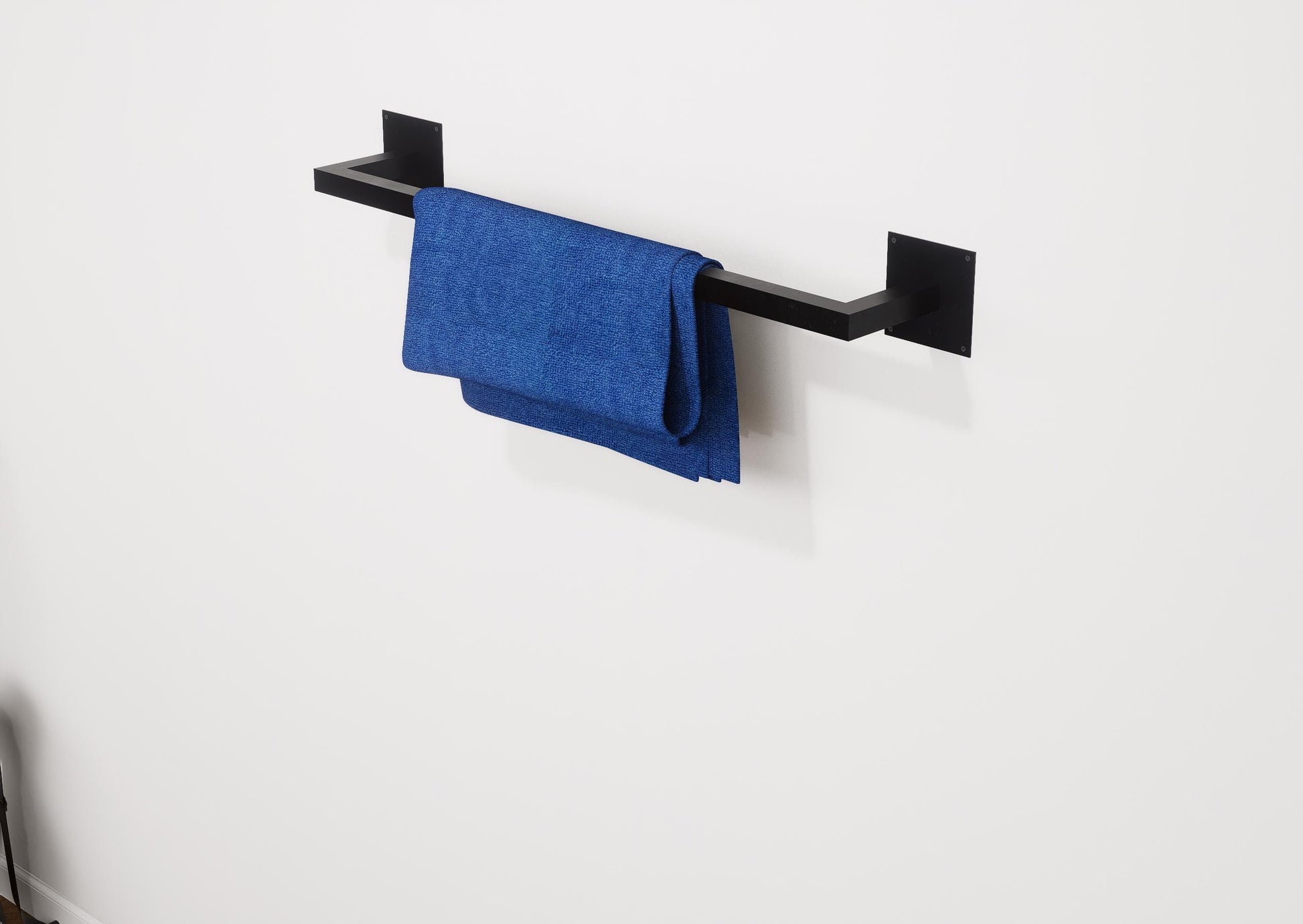 Minimalist square towel holder made from sturdy metal, featuring an industrial design. Ideal for organizing towels in the bathroom, adding a modern touch to decor. Durable and easy to install.