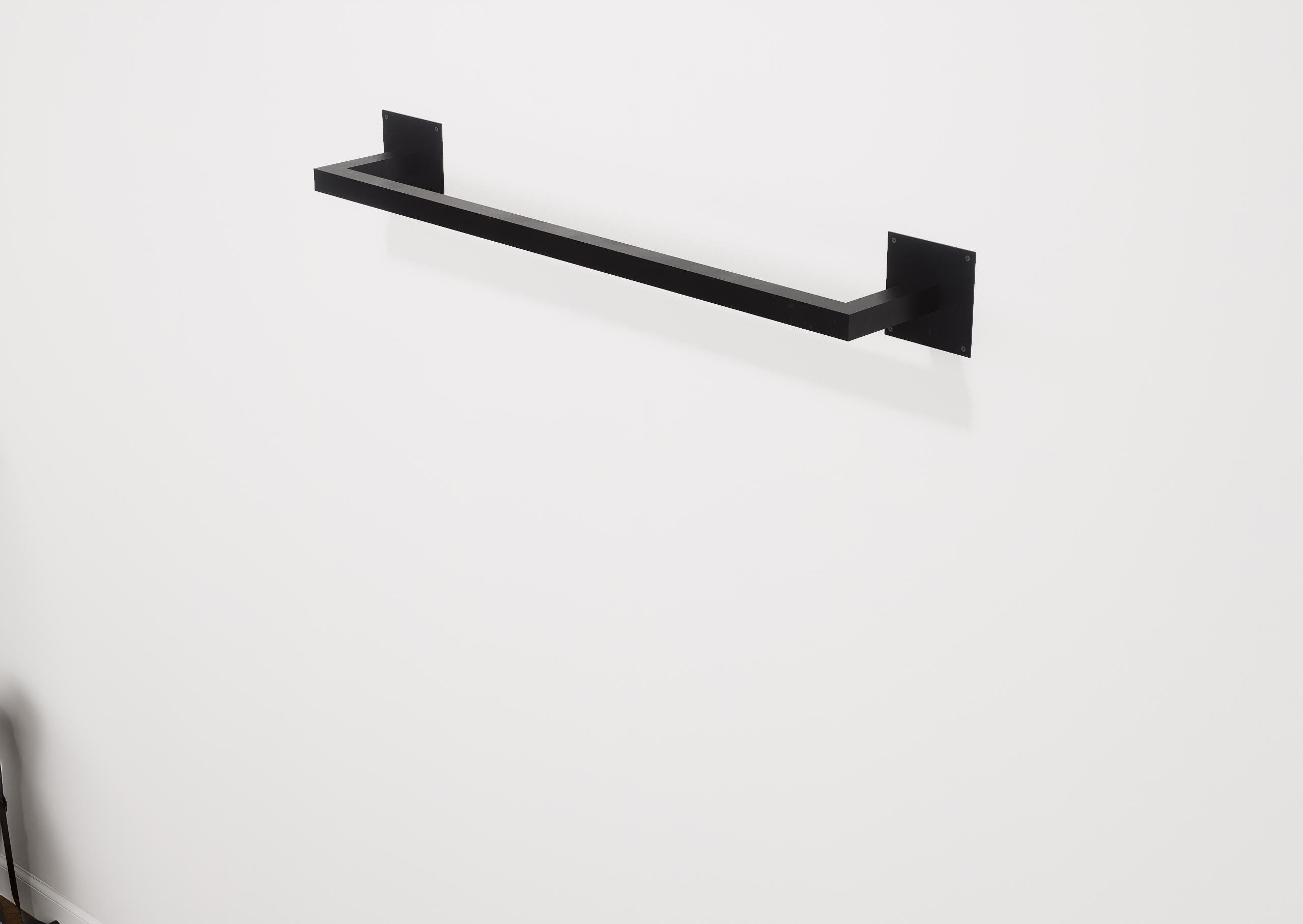 Minimalist square towel holder made from sturdy metal, featuring an industrial design. Ideal for organizing towels in the bathroom, adding a modern touch to decor. Durable and easy to install.