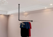 a clothes rack with clothes hanging from it
