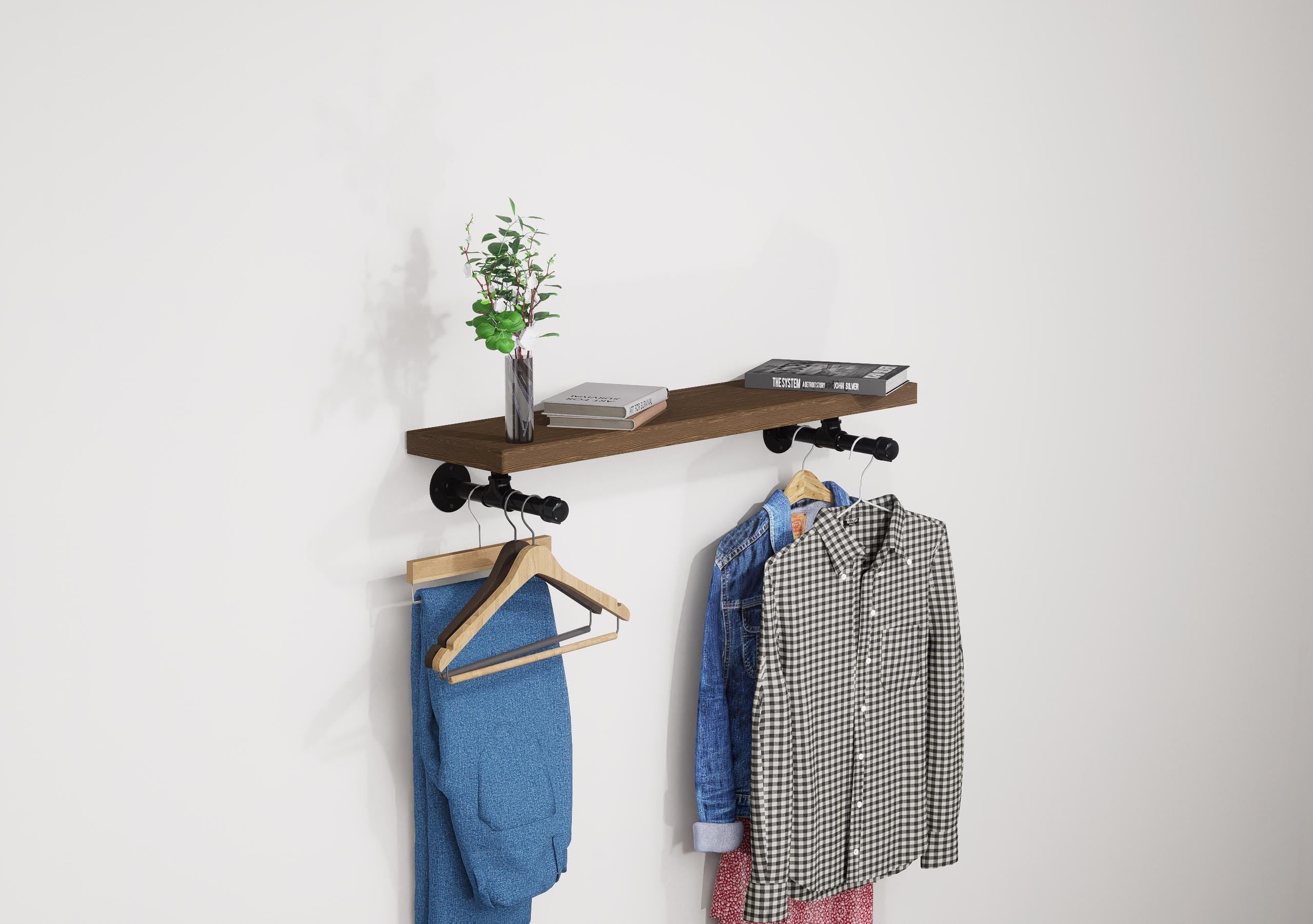 Wall-mounted industrial shelf with a wooden shelf and metal pipe fittings, featuring a hanging rail for clothes storage.