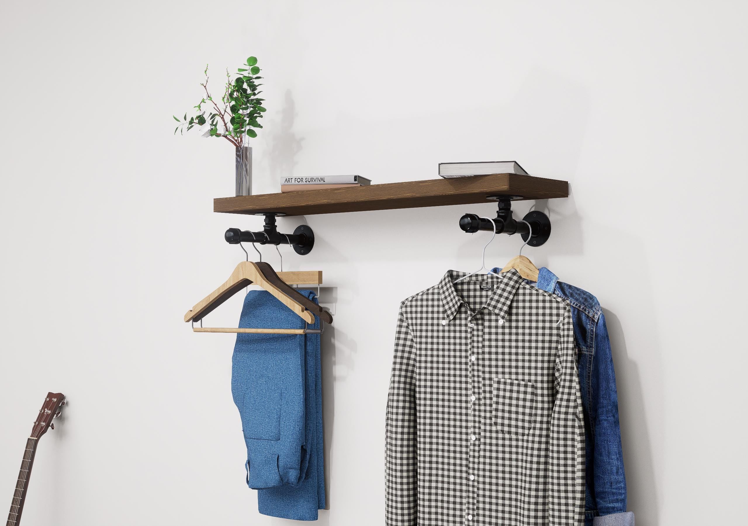 Wall-mounted industrial shelf with a wooden shelf and metal pipe fittings, featuring a hanging rail for clothes storage.