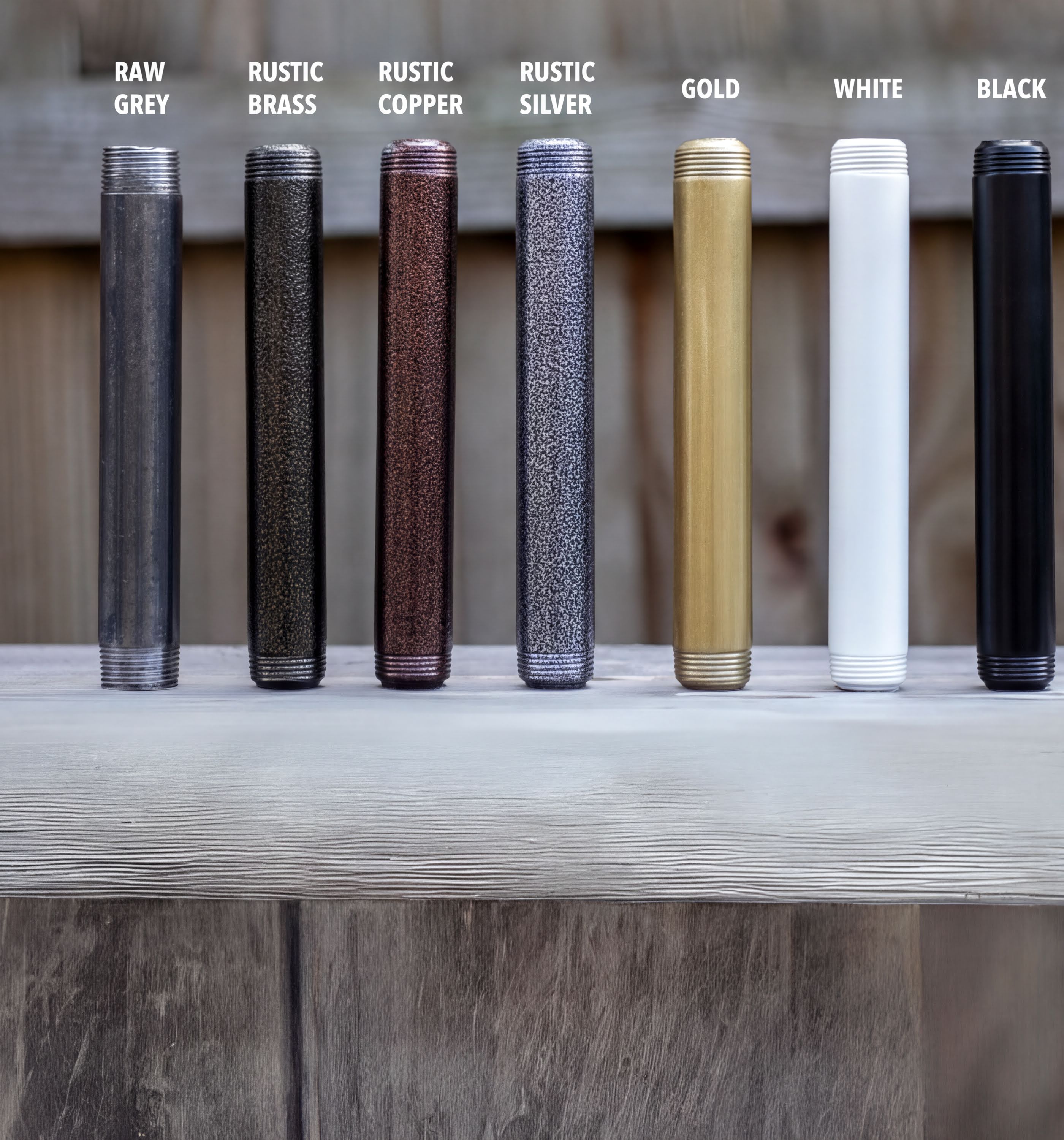a collection of metal pipes in various colors, including raw grey, rustic brass, rustic copper, rustic silver, gold, black, and white.