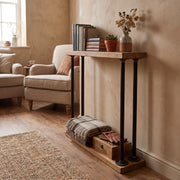 Wooden side table with books and decorative items in a living room setting