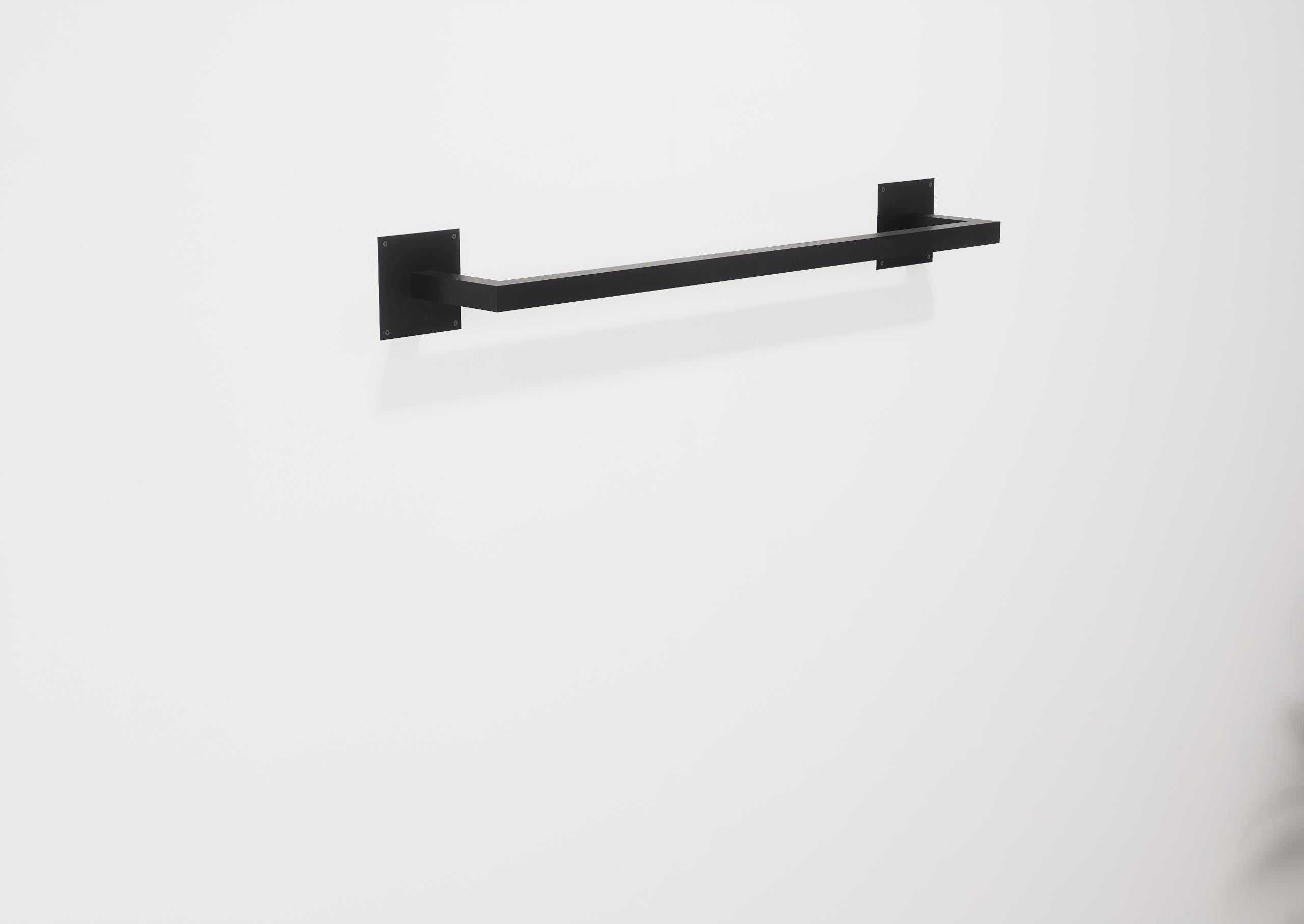Minimalist square towel holder made from sturdy metal, featuring an industrial design. Ideal for organizing towels in the bathroom, adding a modern touch to decor. Durable and easy to install.
