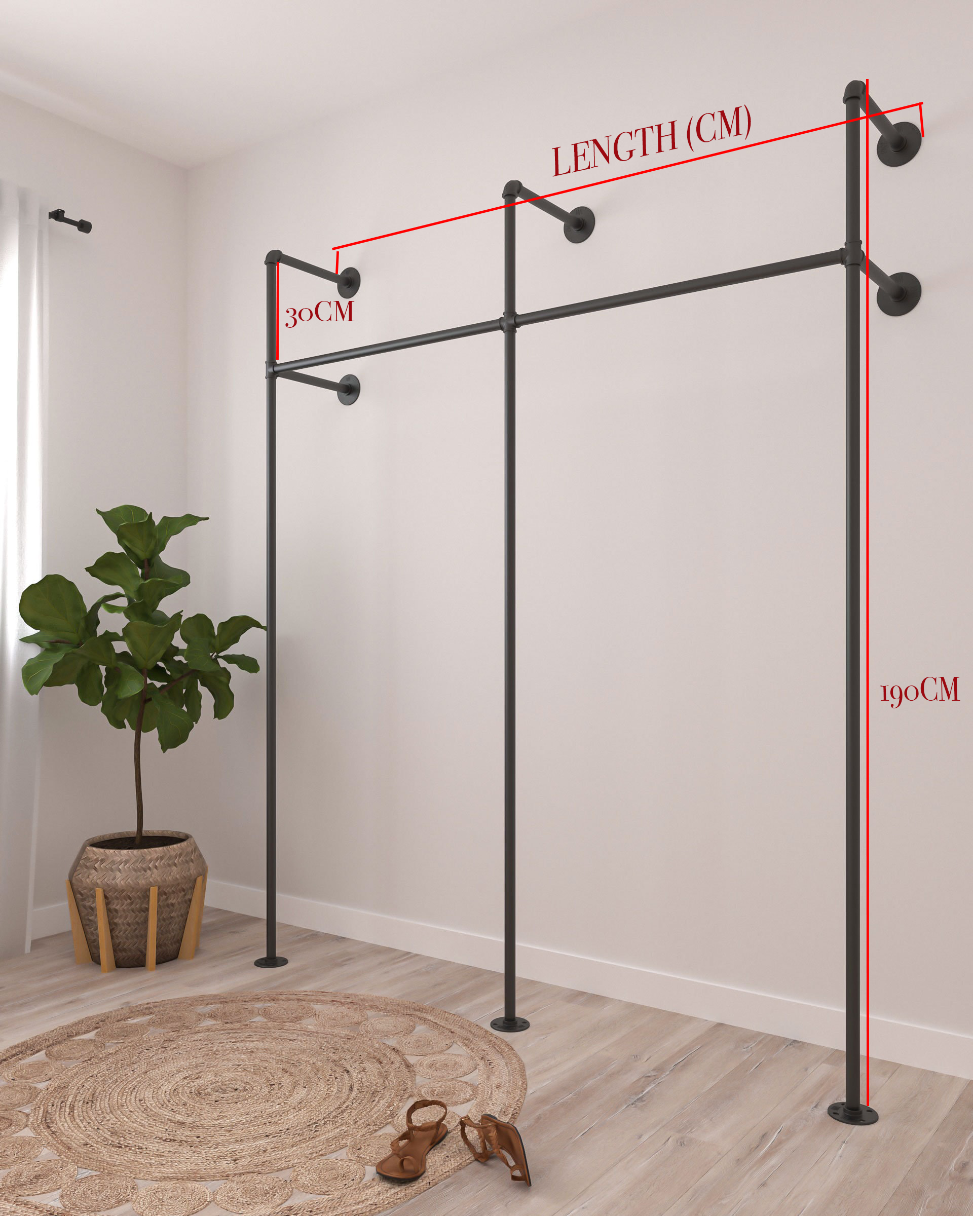 Glide Pipe Garment Rack wall-mounted, showcasing its industrial design and functionality for hanging clothing