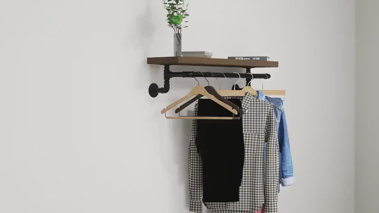 Load video: Industrial Wall-Mounted Clothing Rack with Wooden Shelf and Pipe Design - Stylish Storage Solution for Entryway or Bedroom