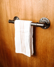 Wall Mounted Towel Holder Rack filled with towels, showcasing its versatile and space-saving design.