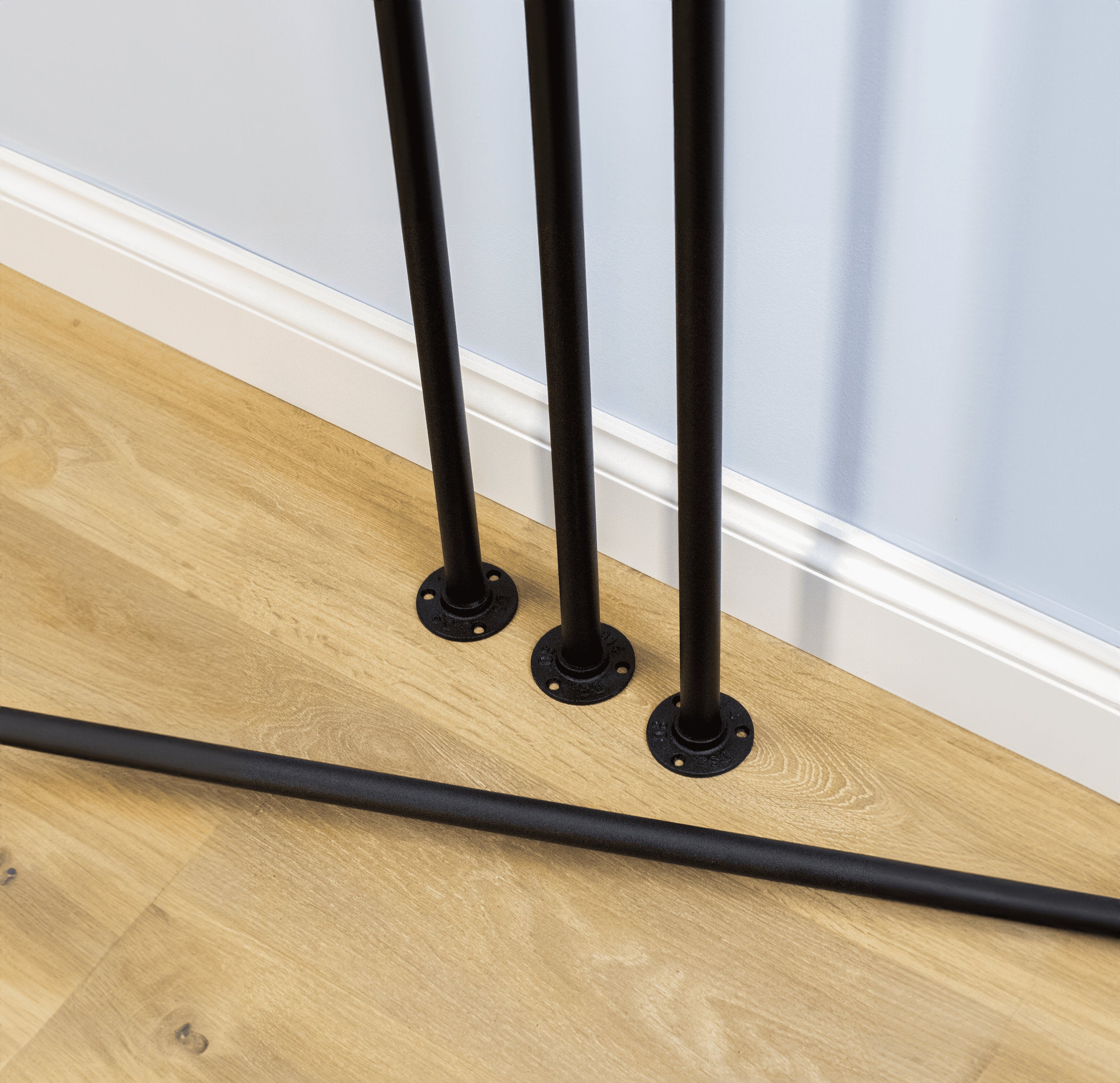 Unique Pipe Table Legs holding various furniture pieces, showcasing their industrial and versatile design